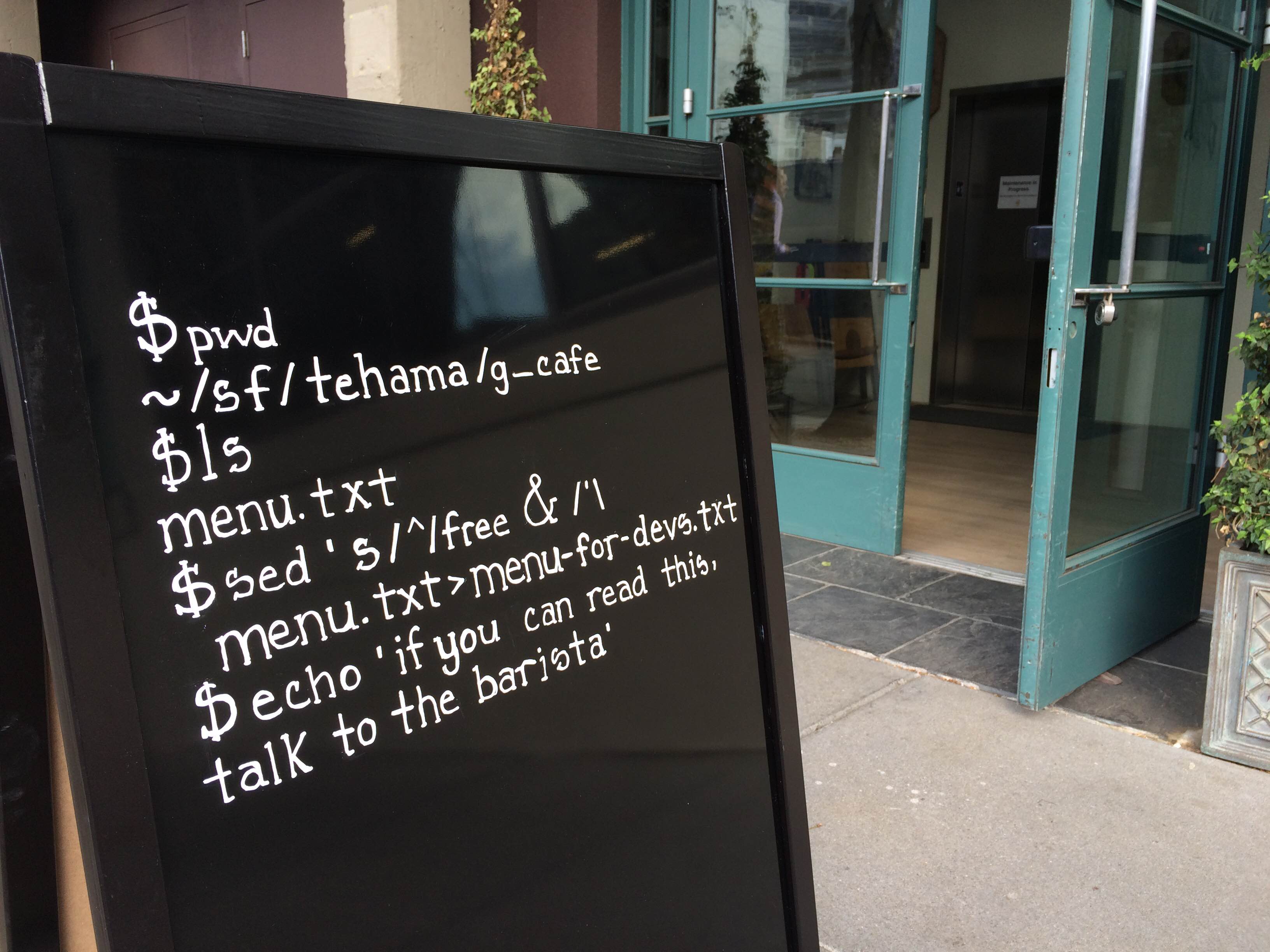 Promo board outside a coffee shop in San Francisco